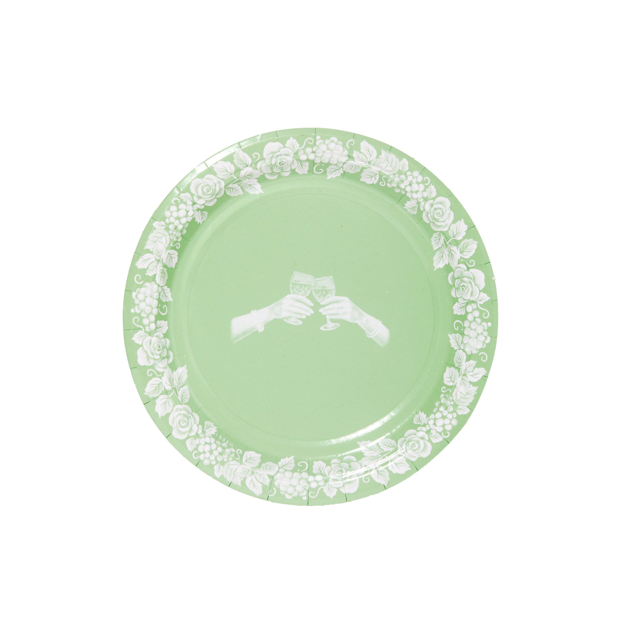 Green plate with white floral pattern on a white background