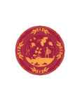 Decorative plate with gold warrior and floral design on a red background